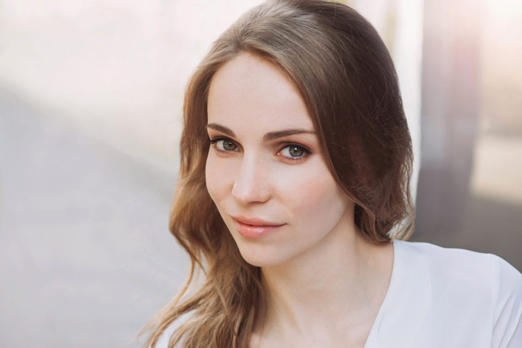 Smiling young woman outdoors