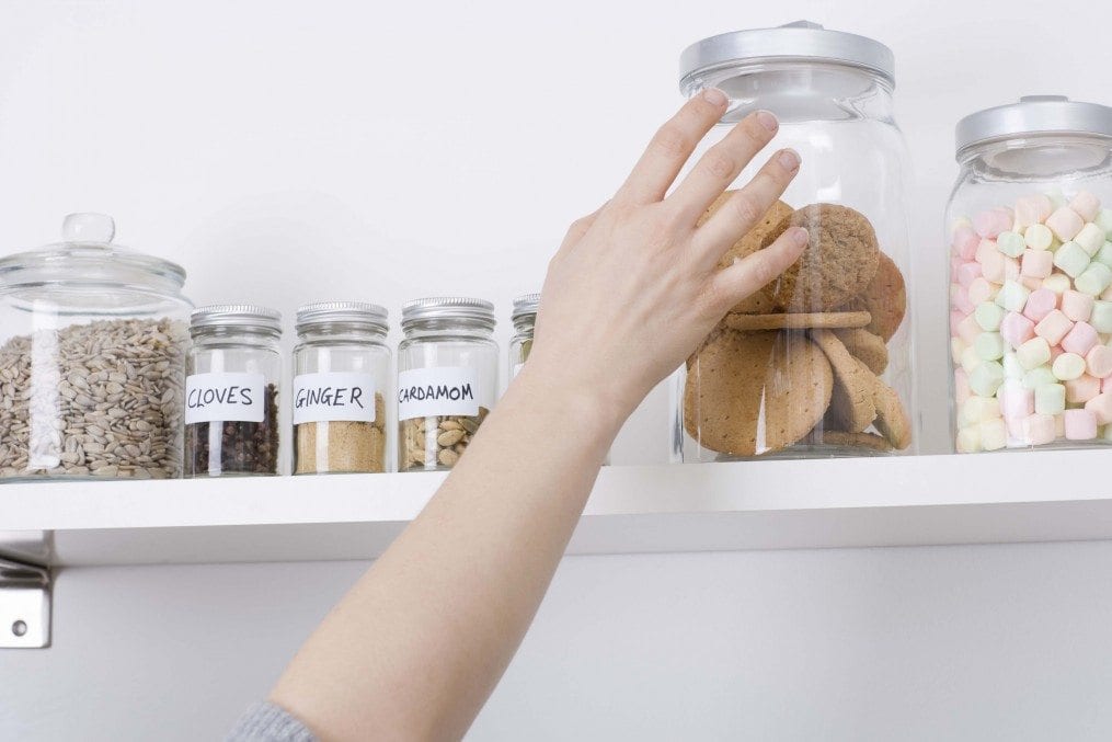 Hand reaching for cookie jar