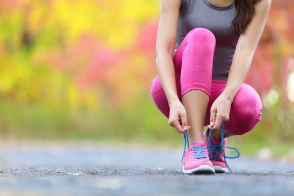 woman tying shoelaces